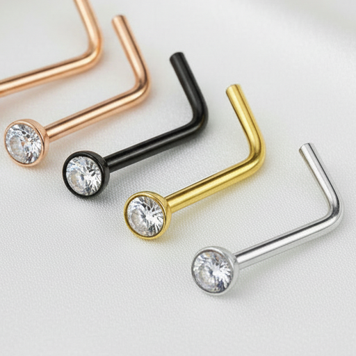 Set of nose rings in gold, rose gold, black, and silver on a white background