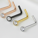 Set of nose rings in gold, rose gold, black, and silver on a white background