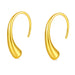 Pair of gold drop earrings on white background