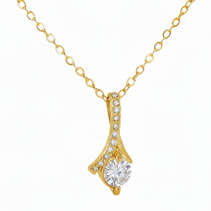 Gold necklace with a pendant on a white background