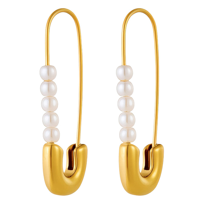 Gold earrings with pearl beads on a white background