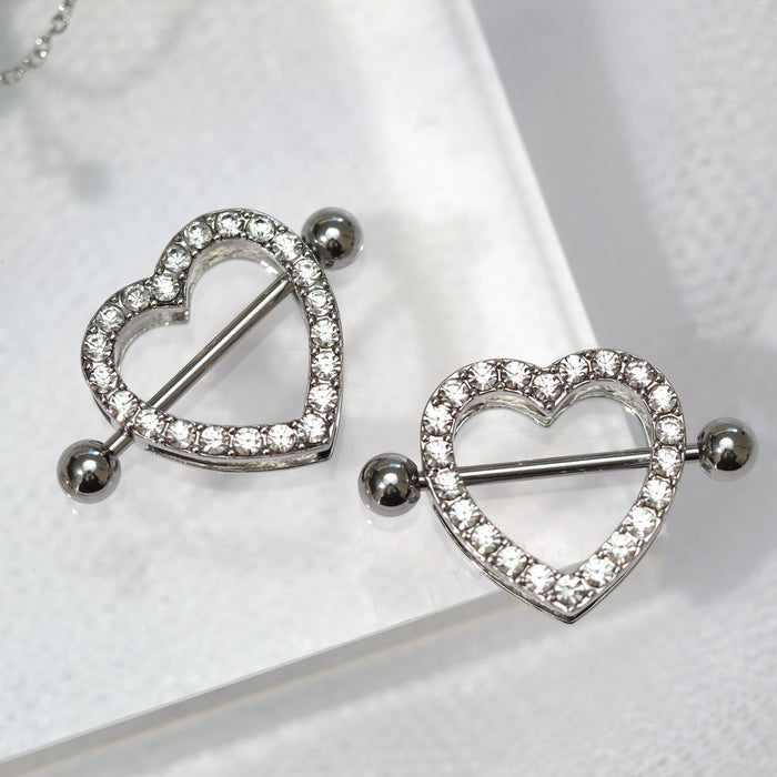 Heart-shaped silver earrings on a white background
