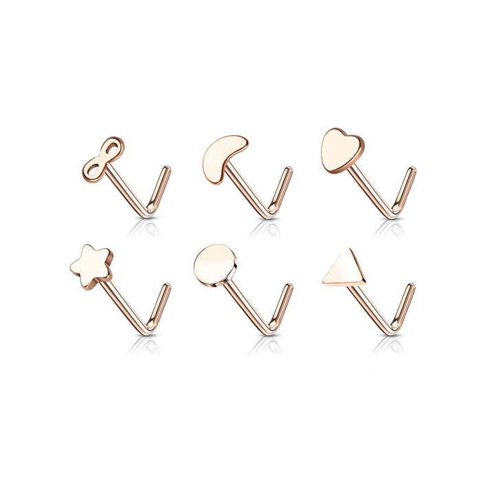 Set of rose gold nose rings with various shapes on a white background