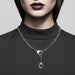 Silver chain necklace on a mannequin with a gray background