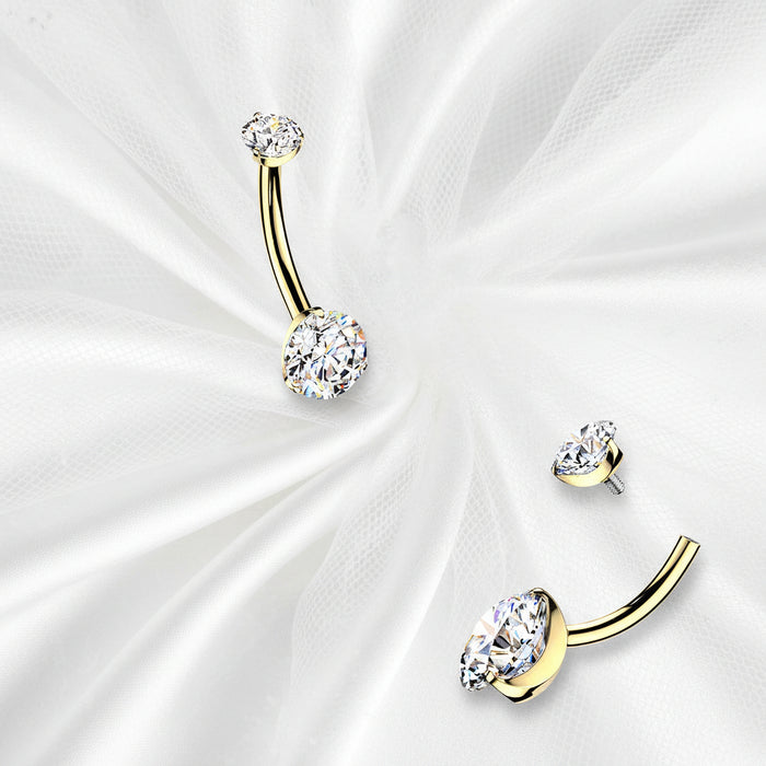 Gold belly button rings with colorful gemstones on a white background