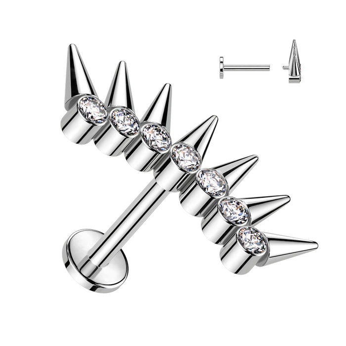 Silver spike earrings with clear gemstones on a white background