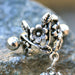 Flower Vine Cartilage Cuff – Antique Floral Stainless Steel Ear Cuff with Clear CZ Dangles sideways on rock display
