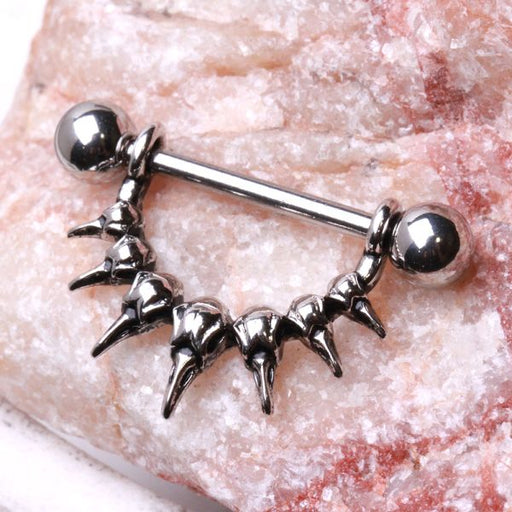 Raven Skull Nipple Dangle – 316L Stainless Steel Nipple Barbell with Detailed Skull Design on pink quartz background