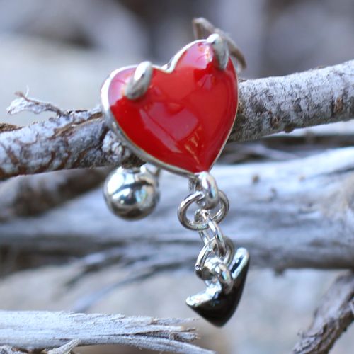 Devil Heart Top Drop Belly Bar displayed on twigs